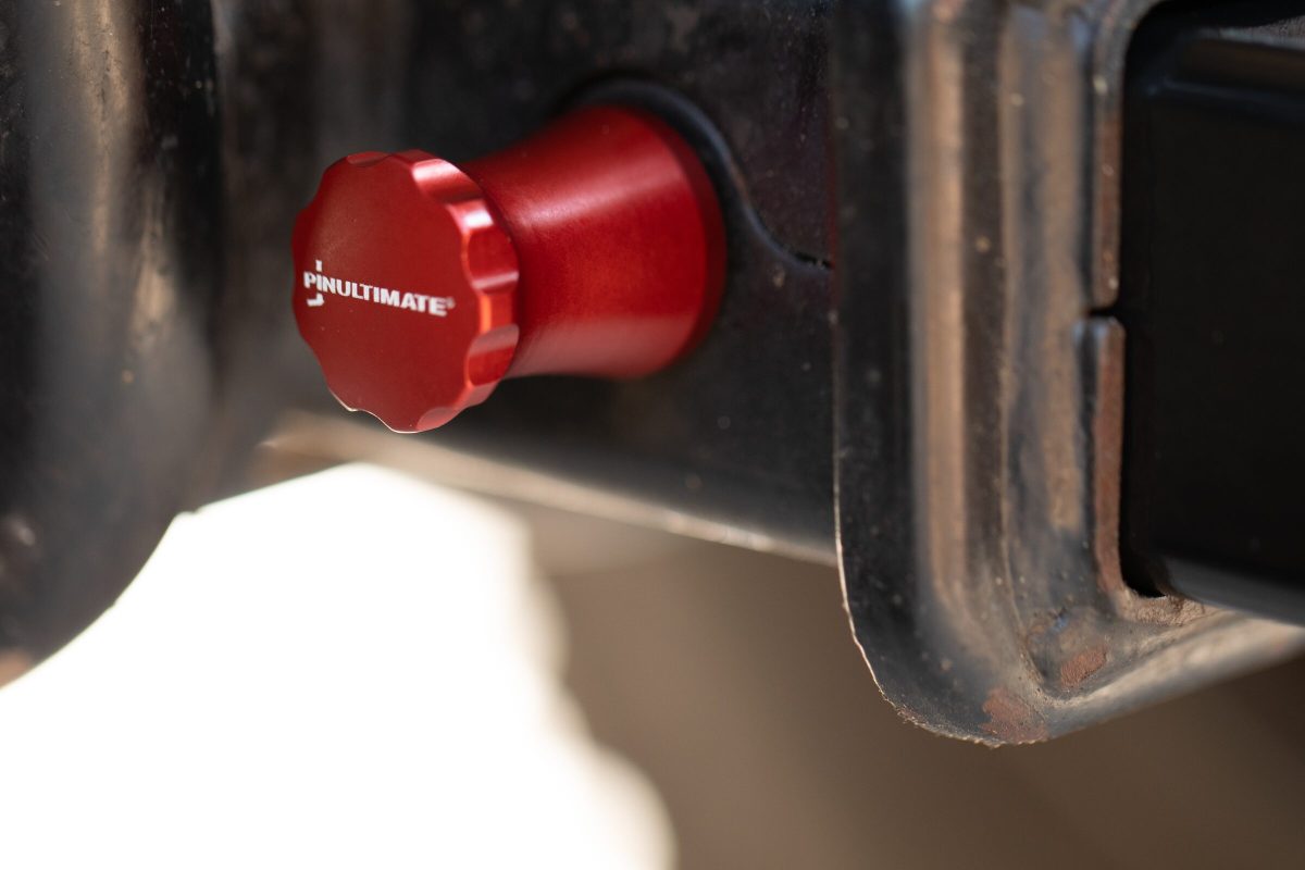 Close-up of the PinUltimate ATV Hitch Pin fluted quick-release knob in a receiver